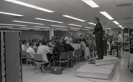 President Newnham Speaking at an Assembly in the Finch Campus Cafeteria