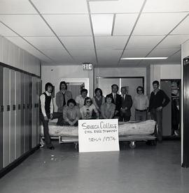 Students and Instructors with a Concrete Canoe