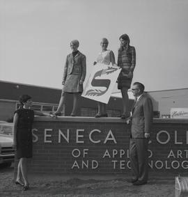 Three Girls from the Fashion Program on Top of the Seneca Sign at Sheppard Campus